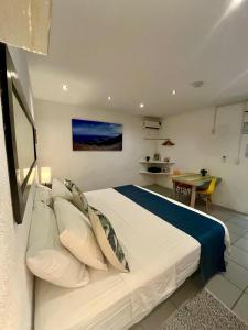 Ένα ή περισσότερα κρεβάτια σε δωμάτιο στο Ocean Lovers Hostel & Apartments