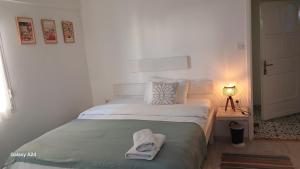 Postel nebo postele na pokoji v ubytování merih butik hotel
