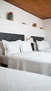 A bed or beds in a room at Hotel Diego Pacho