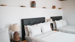 A bed or beds in a room at Hotel Diego Pacho