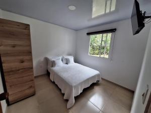 A bed or beds in a room at Hotel Diego Pacho