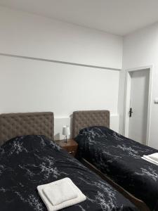 A bed or beds in a room at Apartmani Ćosić - Kuršumlijska banja