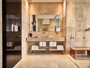 a bathroom with a sink and a mirror at Conservatorium Hotel in Amsterdam