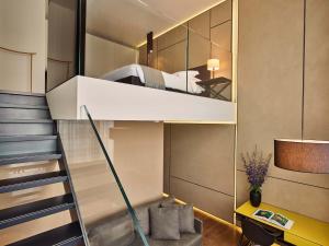 a small apartment with a bunk bed in a room at Conservatorium Hotel in Amsterdam
