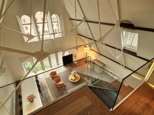 an overhead view of a living room with a glass ceiling at Conservatorium Hotel in Amsterdam