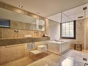 a bathroom with a sink and a mirror at Conservatorium Hotel in Amsterdam