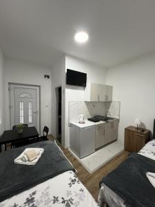 A bed or beds in a room at Apartmani Ćosić - Kuršumlijska banja