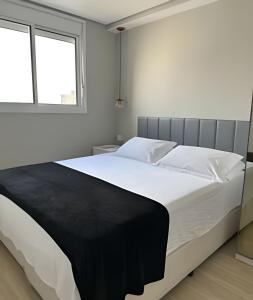 Voodi või voodid majutusasutuse Apartamento com 2 quartos com ar em Moema toas