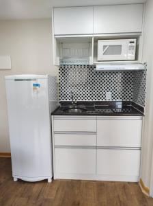 Kuchyň nebo kuchyňský kout v ubytování Flat em pinheiros equipado em hotel 4 stat