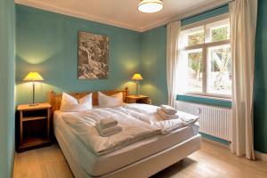 Ένα ή περισσότερα κρεβάτια σε δωμάτιο στο Apartment Schrammsteinblick 2