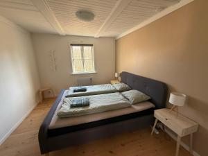 a bedroom with a large bed in a room at Wildlandia Älg Ferienhaus in Hagfors