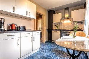 Η κουζίνα ή μικρή κουζίνα στο Apartment Schrammsteinblick 1
