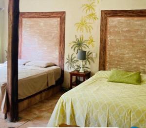 Ένα ή περισσότερα κρεβάτια σε δωμάτιο στο Cabinas Flamingo