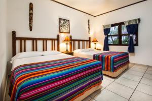 Posteľ alebo postele v izbe v ubytovaní Splash Inn Dive Resort & Villas