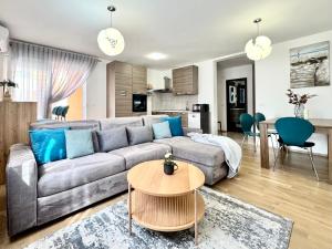 a living room with a couch and a table at Apartments Terra Solaris in Medulin