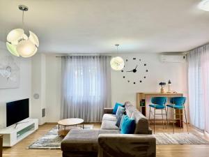a living room with a couch and a table at Apartments Terra Solaris in Medulin