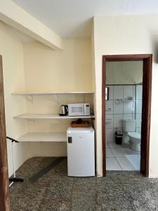 A cozinha ou cozinha compacta de Pousada Kembali Maresias