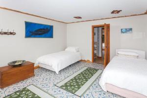 מיטה או מיטות בחדר ב-Reefers