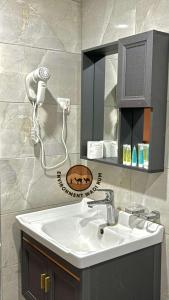 a bathroom with a sink and a hair dryer at environment wadi rum in Wadi Rum +17 photos