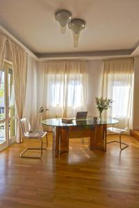 a room with a table with a laptop on it at Verde Di Calabria in Palmi +14 photos