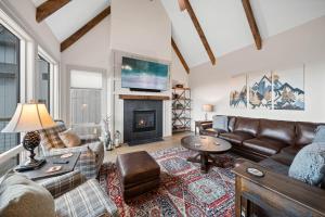 a living room with a couch and a fireplace at Happy Campers in Boone