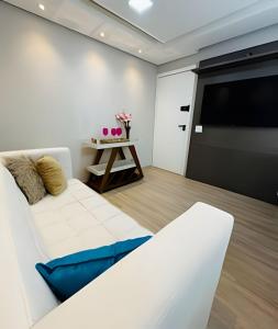 En eller flere senge i et værelse på Condomínio Mundi Resort