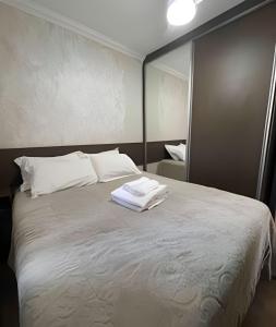 En eller flere senge i et værelse på Condomínio Mundi Resort + 17 billeder