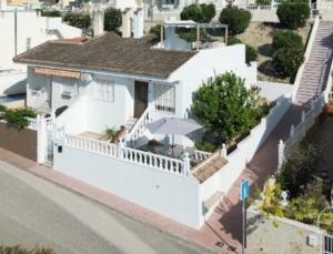 an aerial view of a white house with a balcony at Casa Blancos in Rojales