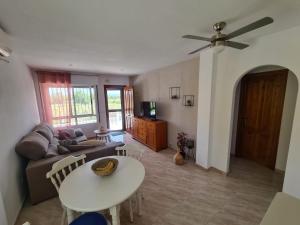 a living room with a couch and a table at Casa Blancos in Rojales