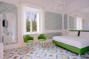 Katil atau katil-katil dalam bilik di Relais Correale Rooms & Garden
