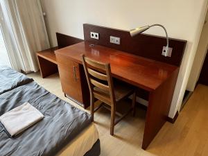 Postel nebo postele na pokoji v ubytování Hotel Tenova Köln-Neumarkt