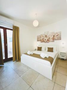 Postel nebo postele na pokoji v ubytování Paradise Rooms