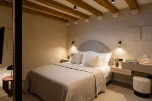 a bedroom with a white bed in a room at Old Town Olive Studio Apartment in Dubrovnik