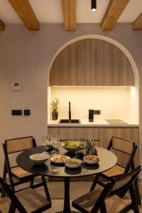 a table with bowls of food on it in a kitchen at Old Town Olive Studio Apartment in Dubrovnik