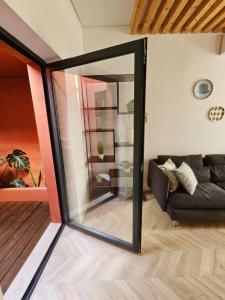 a living room with a sliding glass door at City Center Terrace in Faro