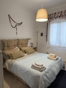Postel nebo postele na pokoji v ubytování La casa di Giulia