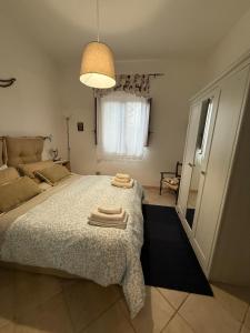 Postel nebo postele na pokoji v ubytování La casa di Giulia