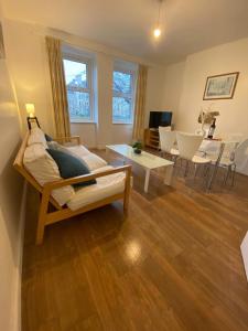 a living room with a couch and a table at Leith Apartment in Edinburgh