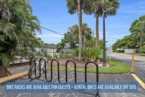 a bike rack with bikes parked on a street at Luxury With Private Lanai Views and Close to the Pool in Naples