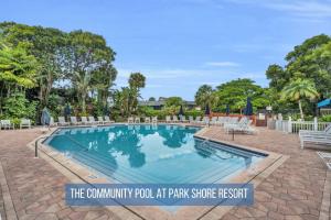 a swimming pool at the community pool at park playswick resort at Luxury With Private Lanai Views and Close to the Pool in Naples