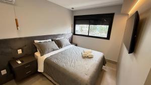 a small bedroom with a bed and a window at ID Vida Urbana - Paraiso em Goiania in Goiânia +38 photos