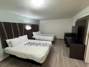 Letto o letti in una camera di Hotel 191 - Moab