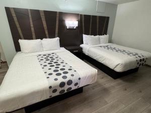 Letto o letti in una camera di Hotel 191 - Moab