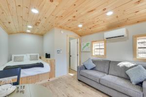 a living room with a couch and a bed at Close to Trails Studio with Water Views in Wurtsboro