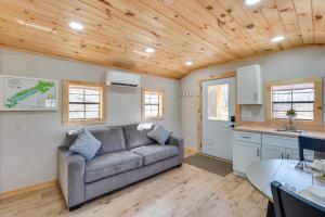 a living room with a couch and a kitchen at Close to Trails Studio with Water Views in Wurtsboro