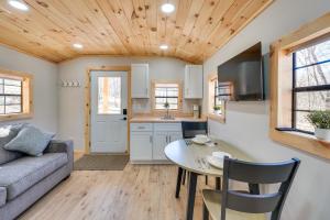 a kitchen and living room with a couch and a table at Close to Trails Studio with Water Views in Wurtsboro