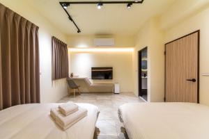 Postel nebo postele na pokoji v ubytování Langchao B&B