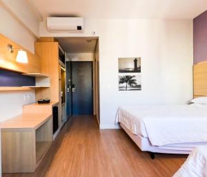 Stay Inn Santos Sua acomodação com cara de Hotel客房内的一张或多张床位