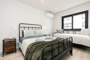 Ένα ή περισσότερα κρεβάτια σε δωμάτιο στο ConceiSol Modern Apartment +18 φωτογραφίες