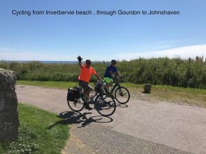 two people riding bikes on a bike path at Driftwood in Gourdon